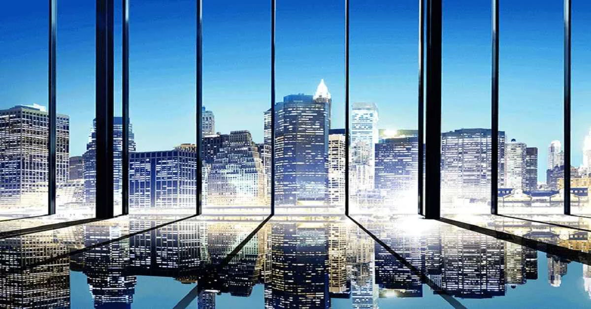 Office windows over a city skyline